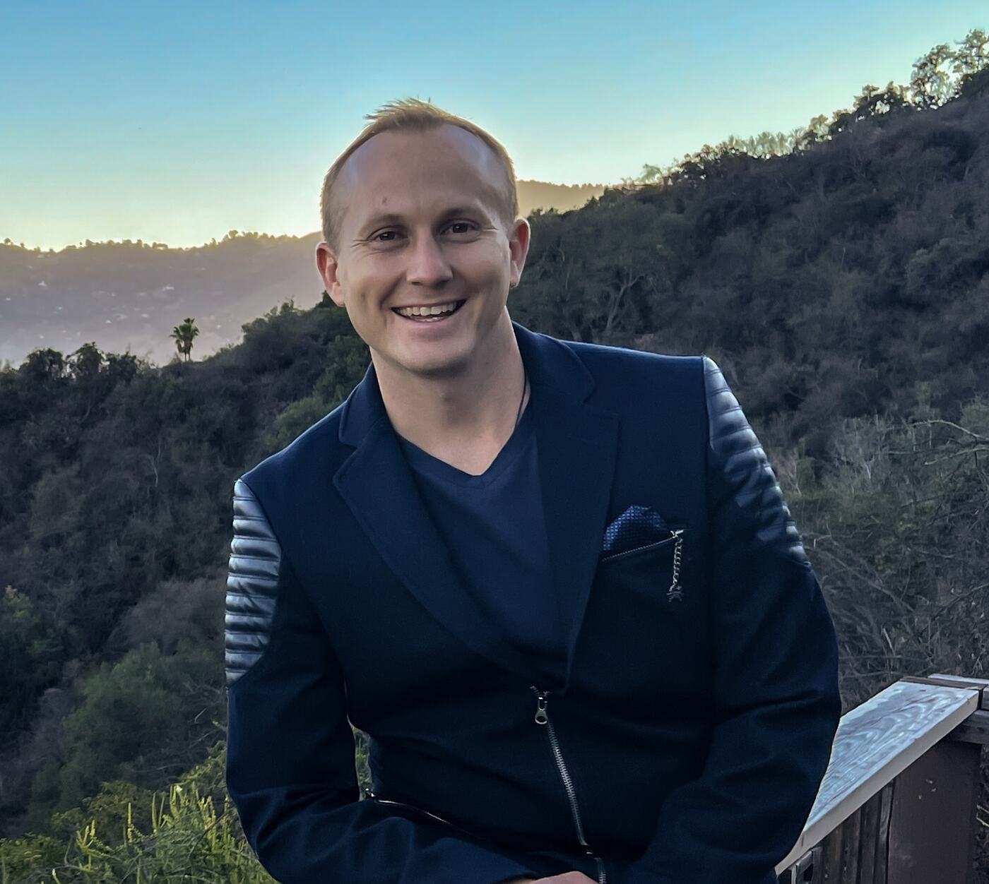 Clifton Smith smiling at dusk above the Topanga hills
